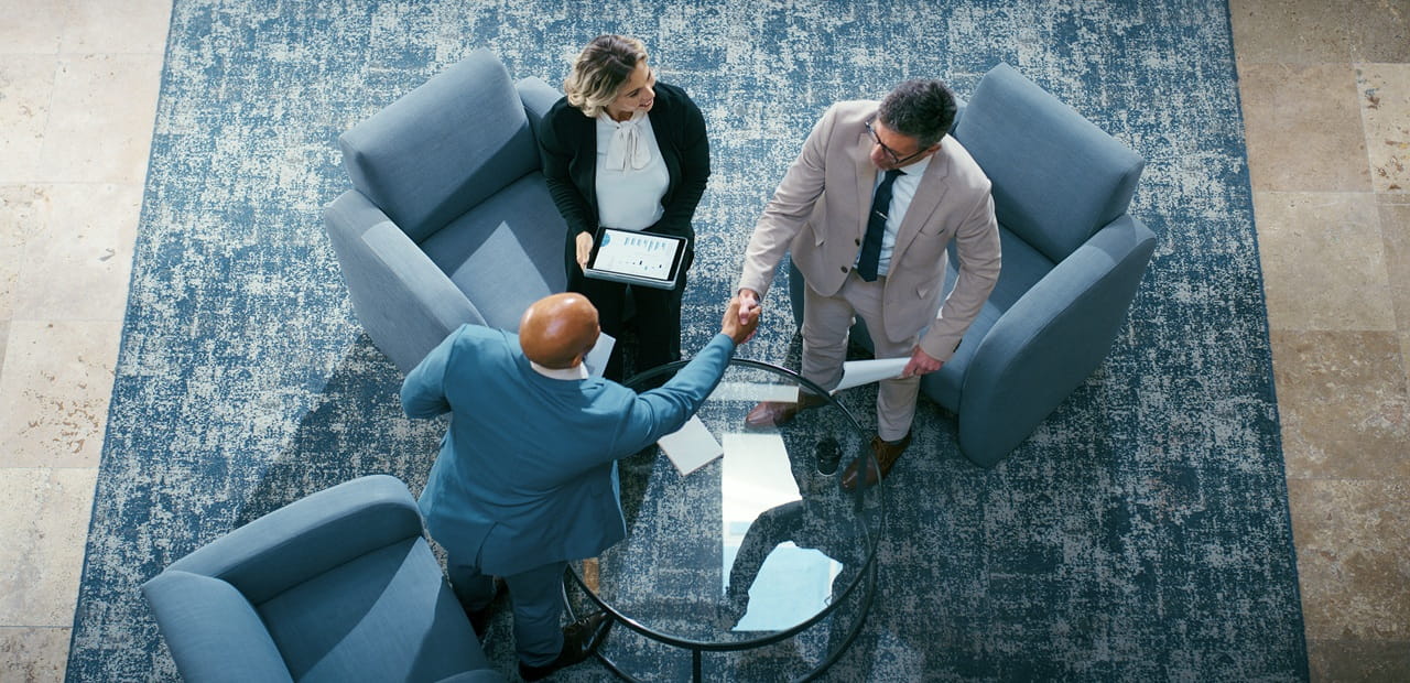 Business owners and advisors meet to discuss growth strategies, highlighting how Qualified Small Business Stock (QSBS) can provide significant tax exemptions and incentives that support long-term business expansion and value creation.