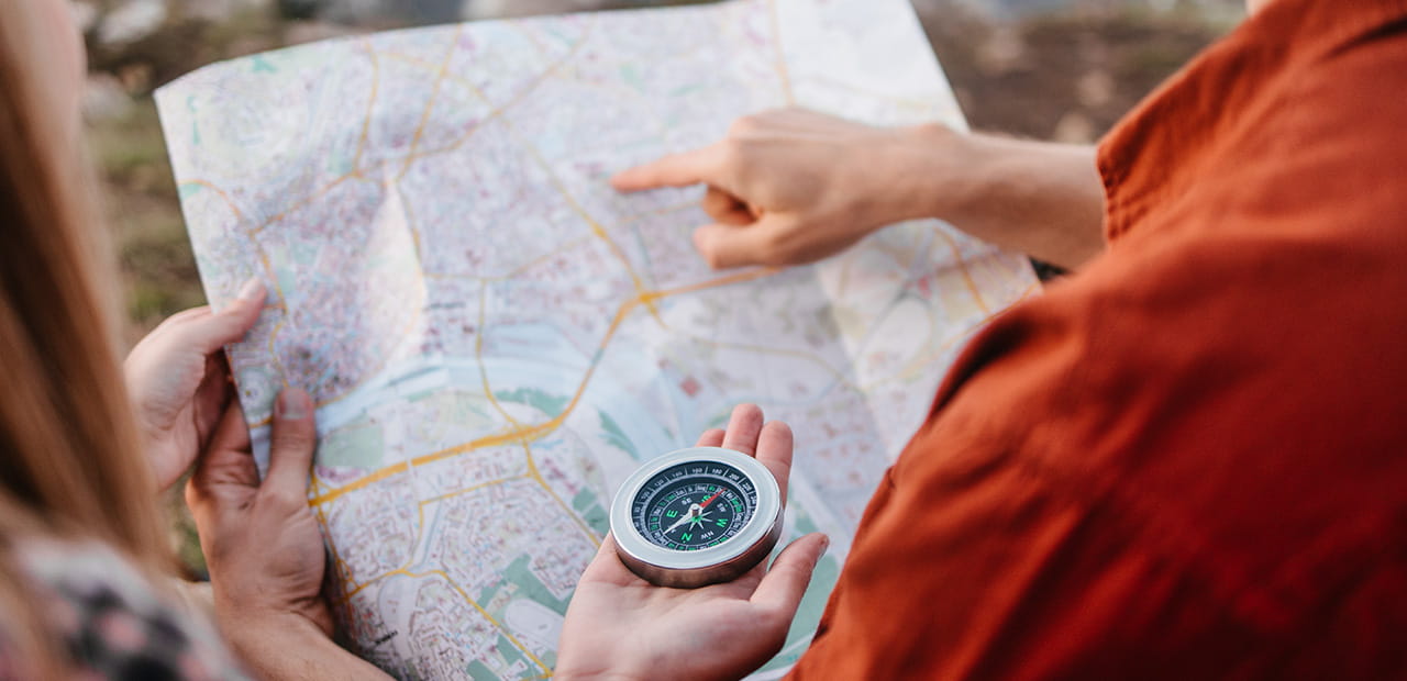 People mapping a route together, symbolizing understanding parents' retirement plans.