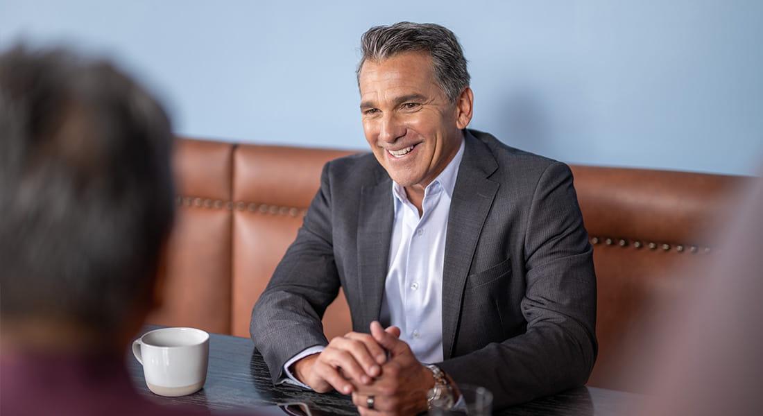 Advisor speaking with clients in meeting