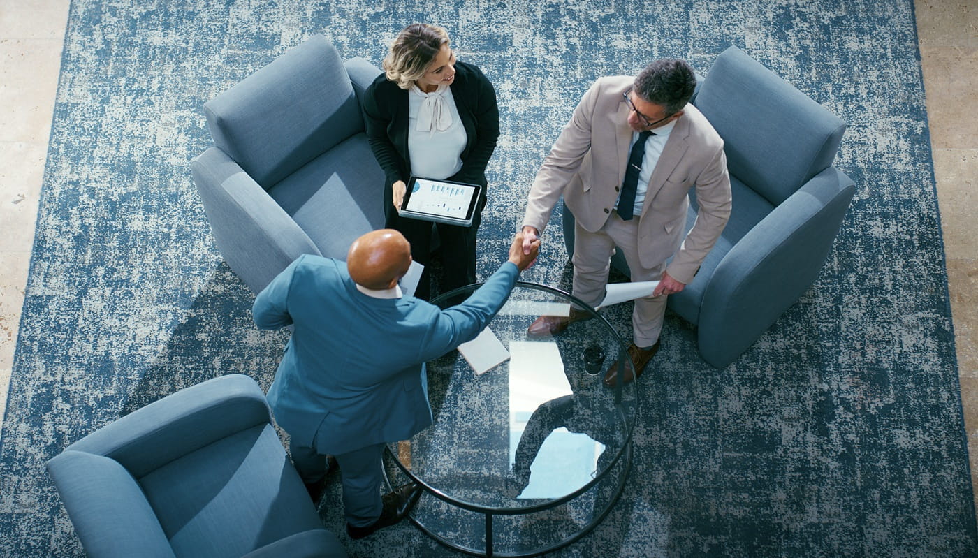 Business owners and advisors meet to discuss growth strategies, highlighting how Qualified Small Business Stock (QSBS) can provide significant tax exemptions and incentives that support long-term business expansion and value creation.