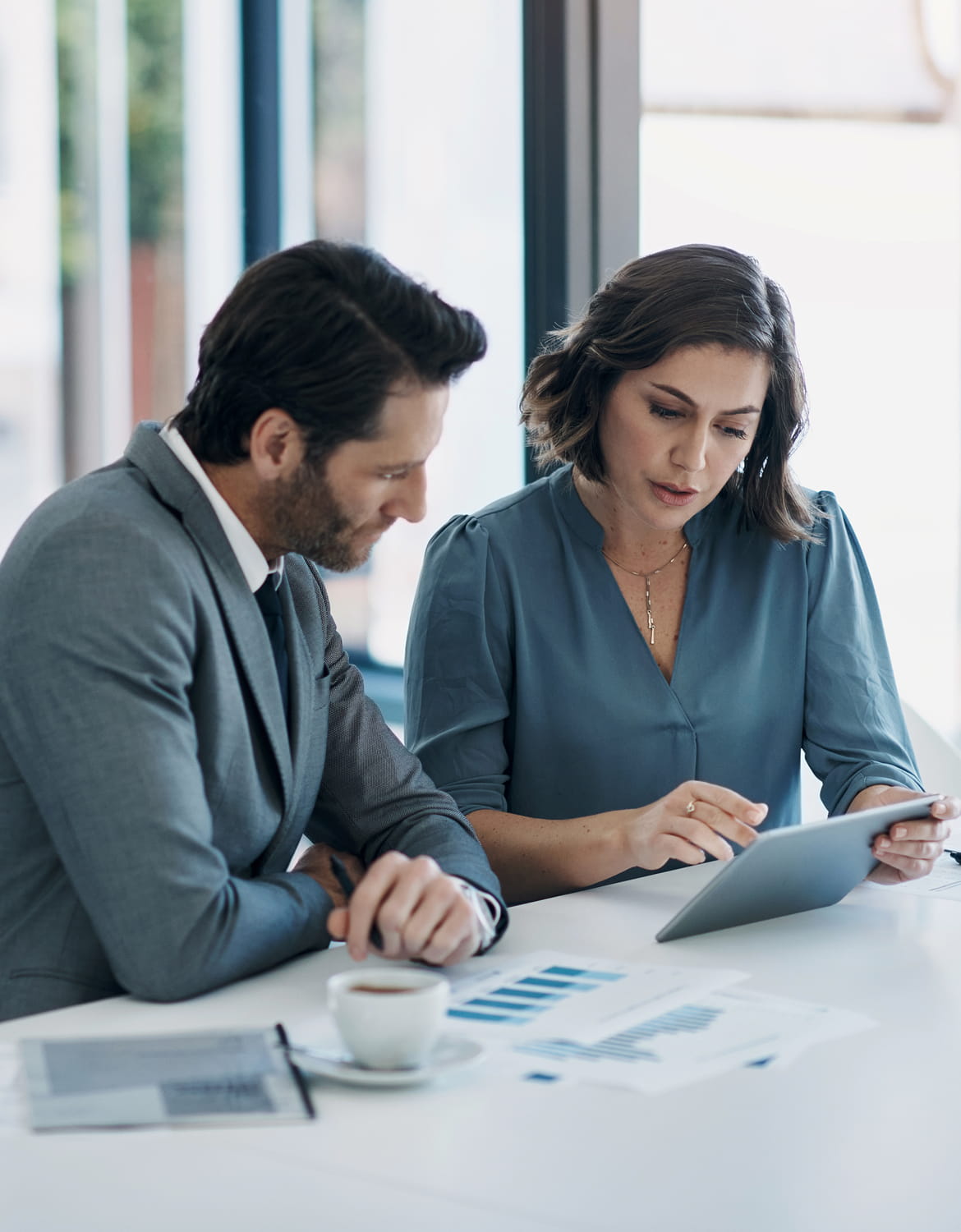 Two business professionals reviewing alternative strategy